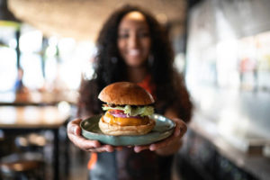 Waitress holding a sandwich